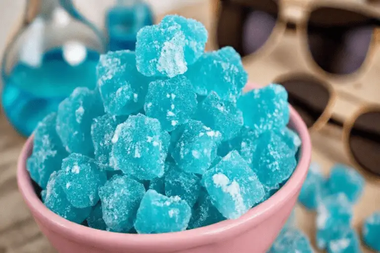 A bowl of bright blue rock candy clusters, inspired by Breaking Bad, with jagged edges and a crystalline appearance.