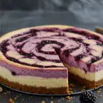 Forbidden Forest Blackberry Butterbeer Cheesecake with a creamy base, blackberry compote swirl, and butterbeer caramel drizzle, surrounded by forest-inspired decorations in a mystical, warm-lit setting.